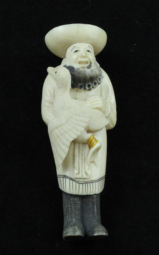 A 20th century ivory netsuke carved