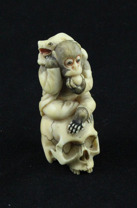 A carved and stained ivory netsuke 1738ce