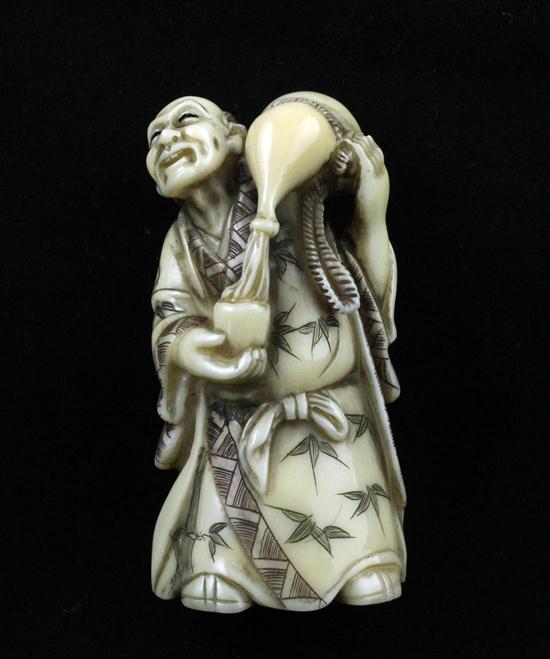 A stained ivory netsuke carved 1738f3