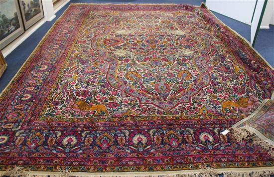 A Kashan carpet the central medallion