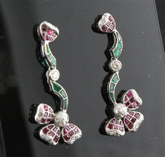 A pair of ruby emerald and diamond