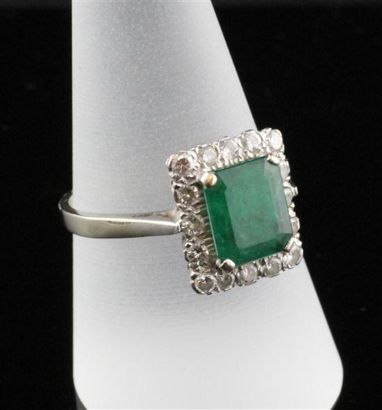 An 18ct white gold emerald and