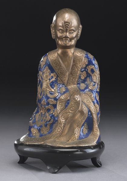 Chinese Qing enamel over bronze figuredepicting