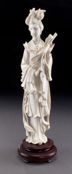 Chinese carved ivory lady holding flowers.(International