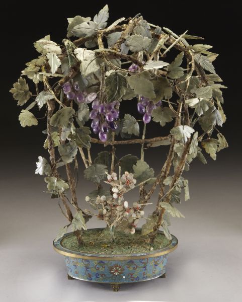 Chinese Qing carved jade tree in a cloisonnebase.