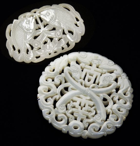 (2) Chinese Qing carved jade pendantsdepicting