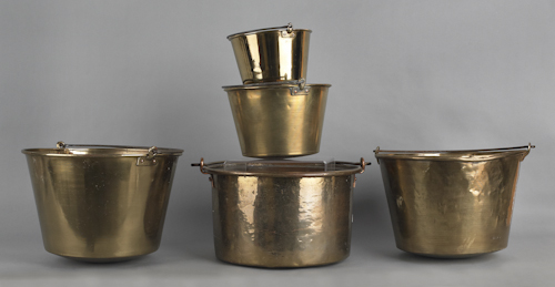 Five brass pots with iron swing
