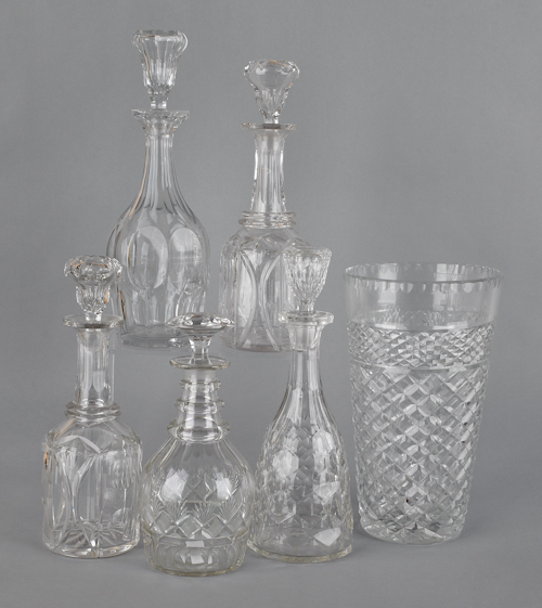Five colorless glass decanters