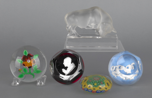 Four glass paperweights to include 176a23