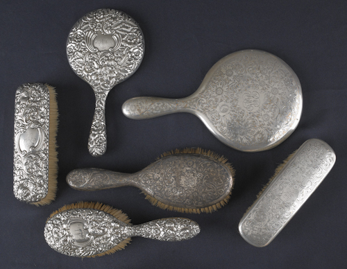 Four silver mounted brushes together