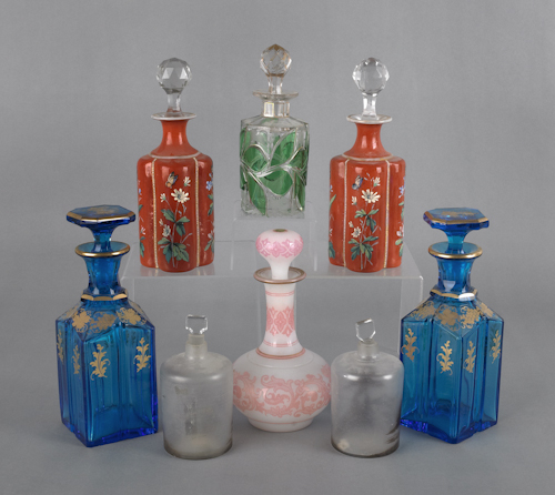Eight glass scent bottles with enamel