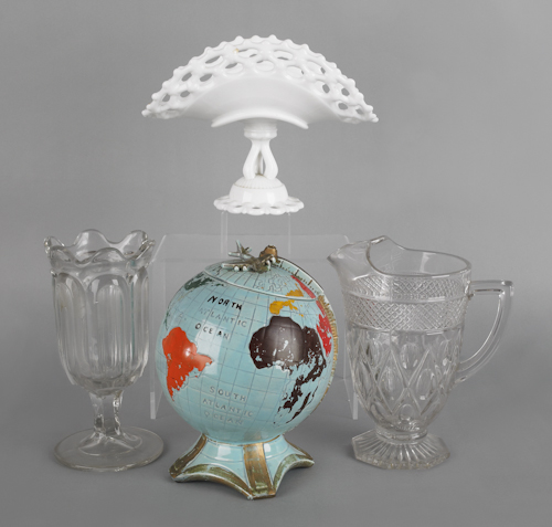 Globe form ceramic cookie jar with an