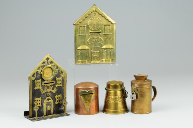 BRASS AND TIN STILL BANKS Grouping includes