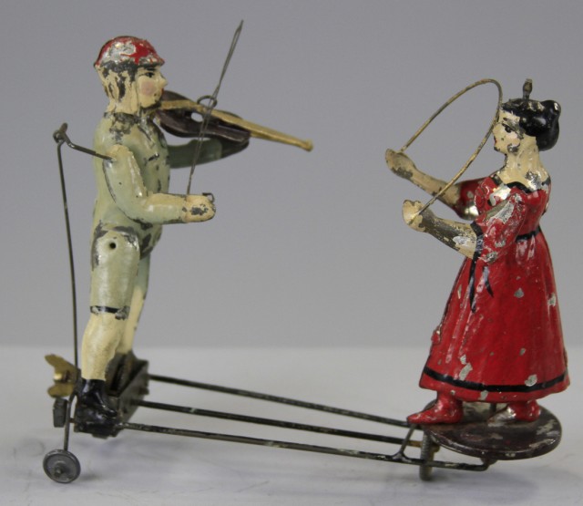 BOY MUSICIAN AND GIRL TWIRLING TOY Germany