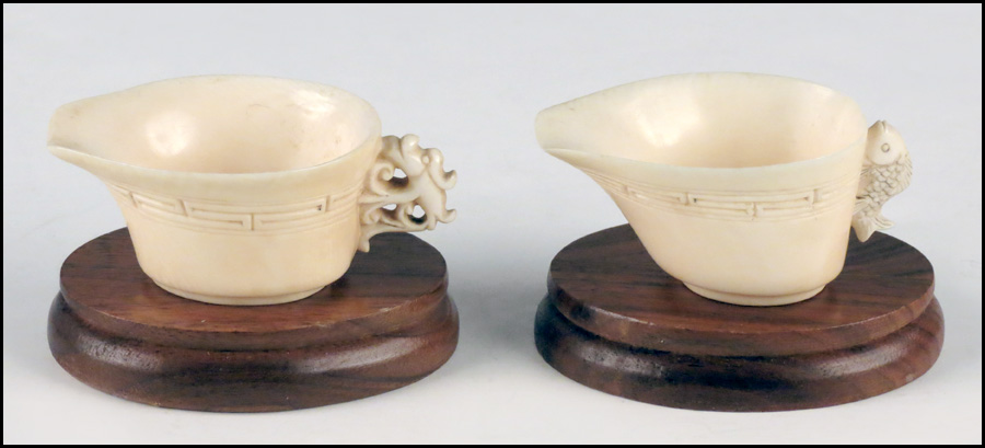 TWO CARVED IVORY HANDLED CUPS  177573