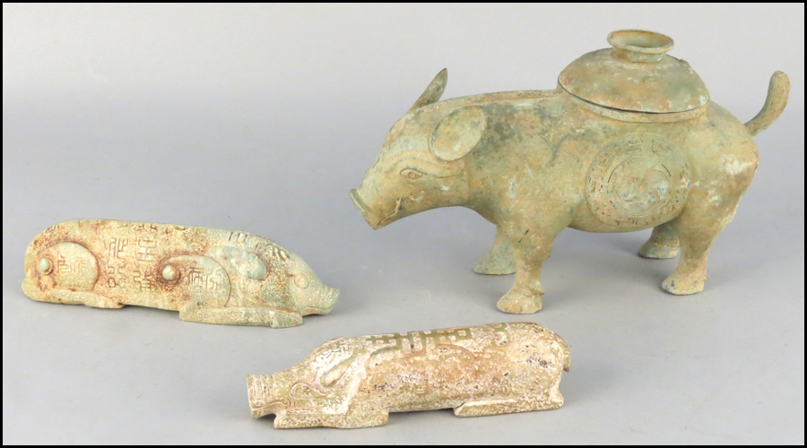 TWO CARVED STONE PIG FORMS. Together