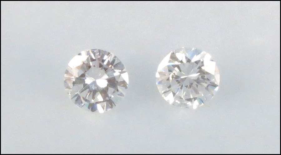 TWO UNMOUNTED DIAMONDS Round brilliant 1776f9