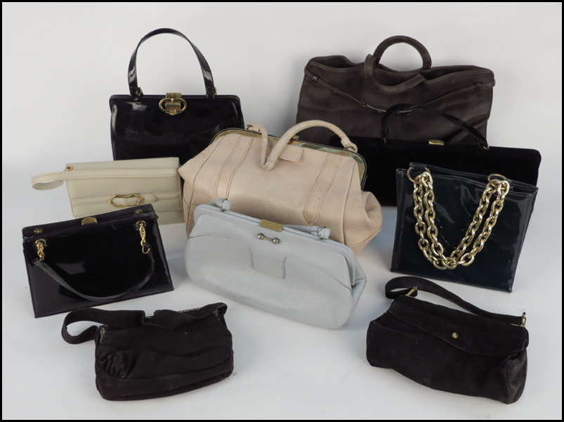 GROUP OF NINE HANDBAGS. Comprising leather