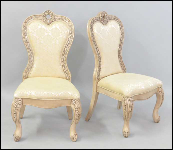 PAIR OF UPHOLSTERED HIGHBACK SIDE CHAIRS.