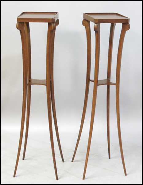 PAIR OF MAHOGANY PLANT STANDS.