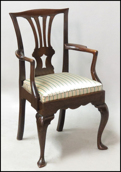 CARVED MAHOGANY OPEN ARMCHAIR.