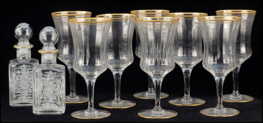 SET OF EIGHT GILT CRYSTAL WATER GOBLETS.