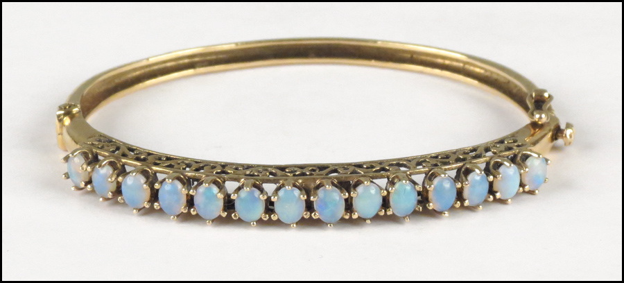 14 KARAT YELLOW GOLD AND OPAL BANGLE