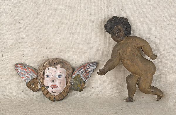 Carved and painted cherub plaque