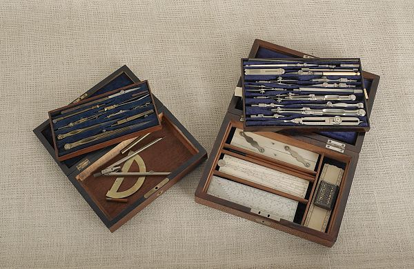 Two drafting sets with rosewood cases.