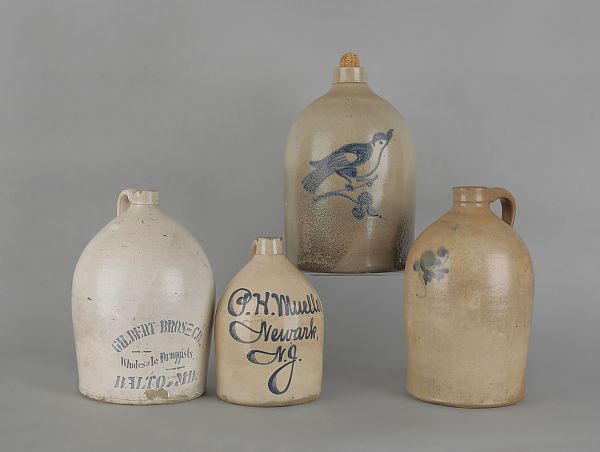 Four cobalt decorated stoneware jugs