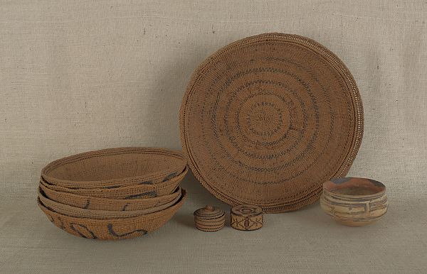 Collection of nine woven baskets together