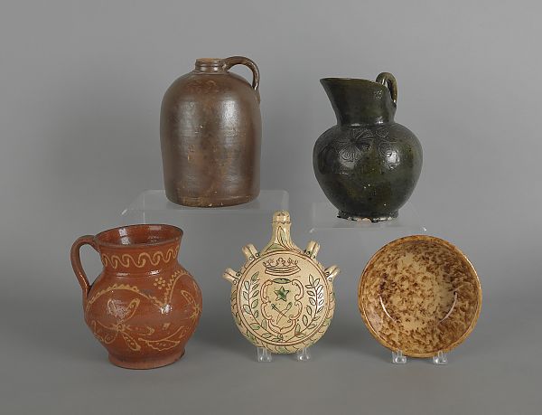 Two redware pitchers together with 175d3c