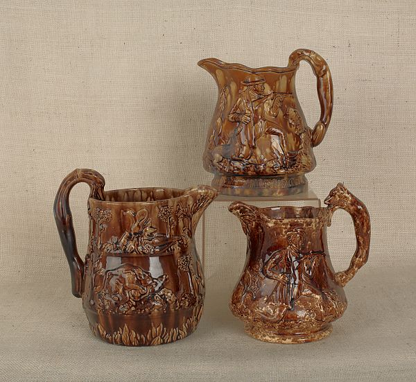 Three Rockingham glaze pitchers 175e05
