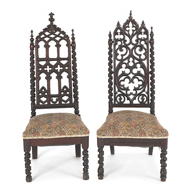 Two Gothic revival carved walnut
