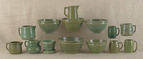 Fourteen pottery mixing bowls mugs