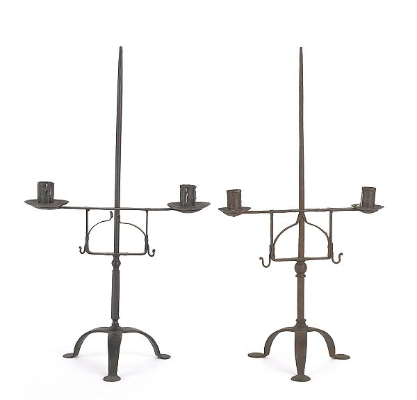 Two wrought iron candle holders