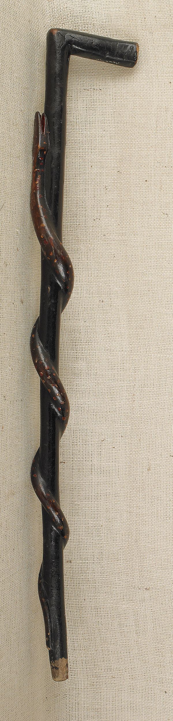 Carved and painted cane with a
