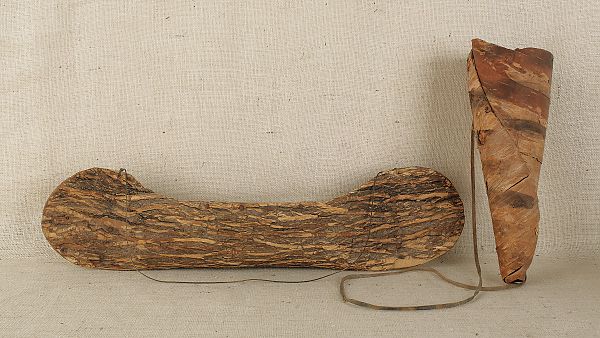 Miniature bark canoe together with