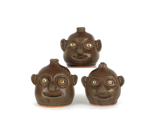Three Georgia stoneware face jugs