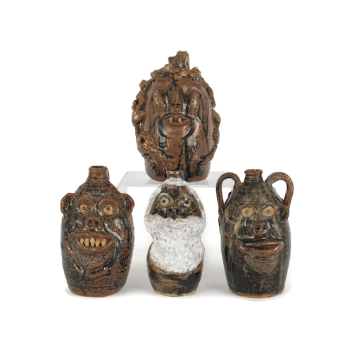 Four Georgia stoneware face jugs