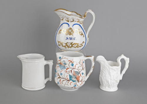 Two painted porcelain pitchers