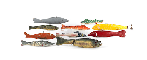Ten carved fish decoys. ?