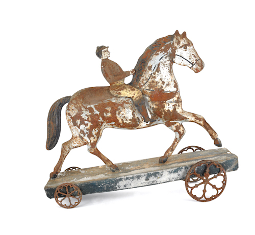 Large painted tin horse and rider pull