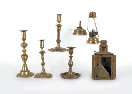 Four brass candlesticks together 17623b