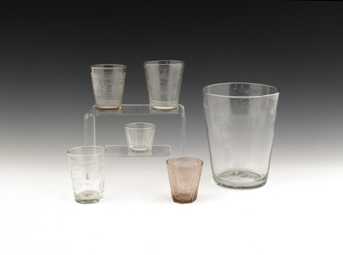 Five etched colorless glass cups
