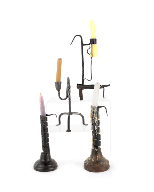 Four iron candleholders 20th c.