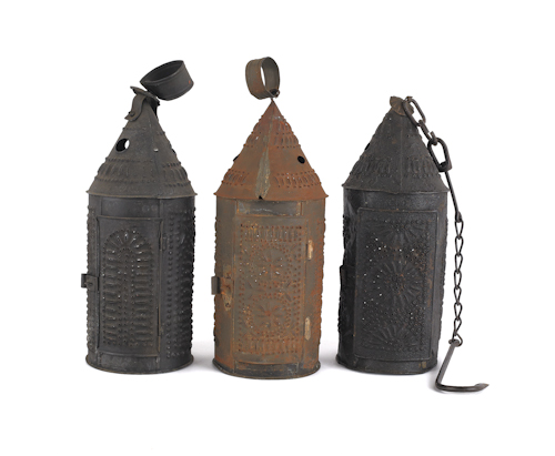 Three punched tin carry lanterns