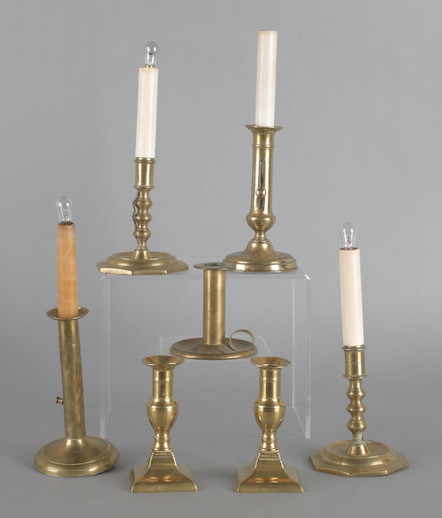 Seven brass candlesticks late 19th