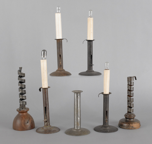 Five hogscraper candlesticks together