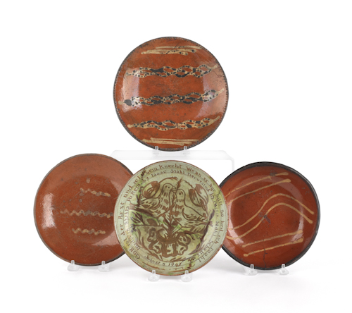 Three slip decorated redware plates